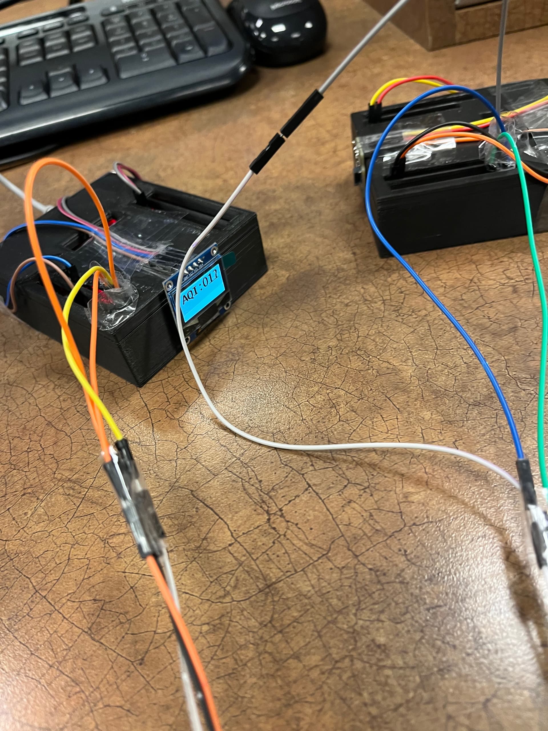 Air quality monitor prototype with wiring and AQI display